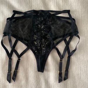 Victoria’s Secret black high waist thong panty with attached garters.